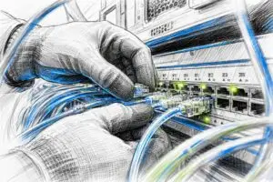 Hands connecting data cables to a network switch